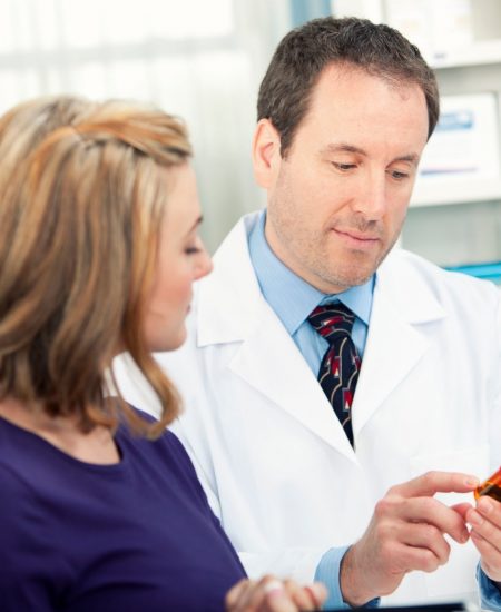 Pharmacist consulting with patient